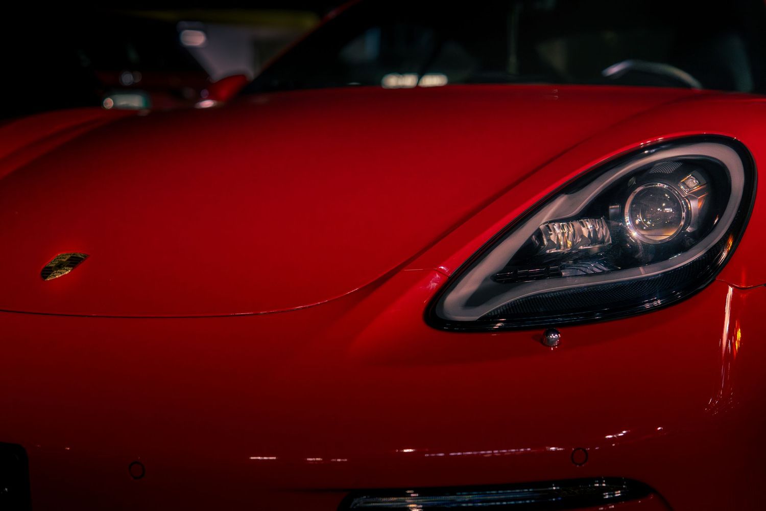 Red sports car detail automotive photography highlighting vehicle design in Saskatoon Saskatchewan.
