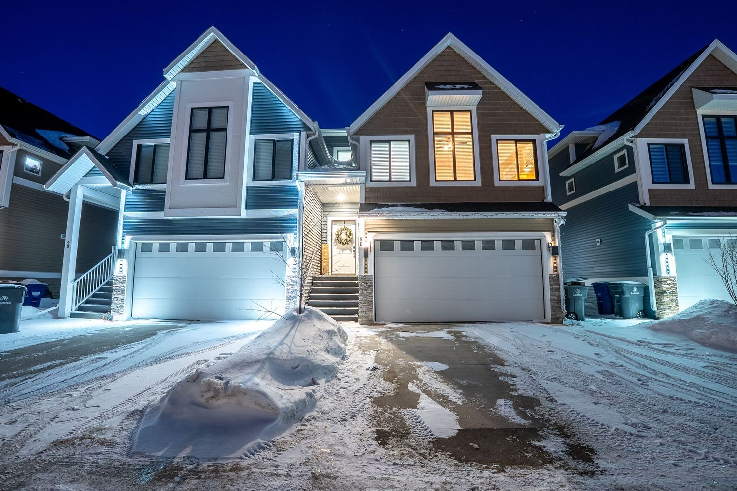 Evening exterior real estate photography in Saskatoon Saskatchewan capturing home with blue hour lighting.