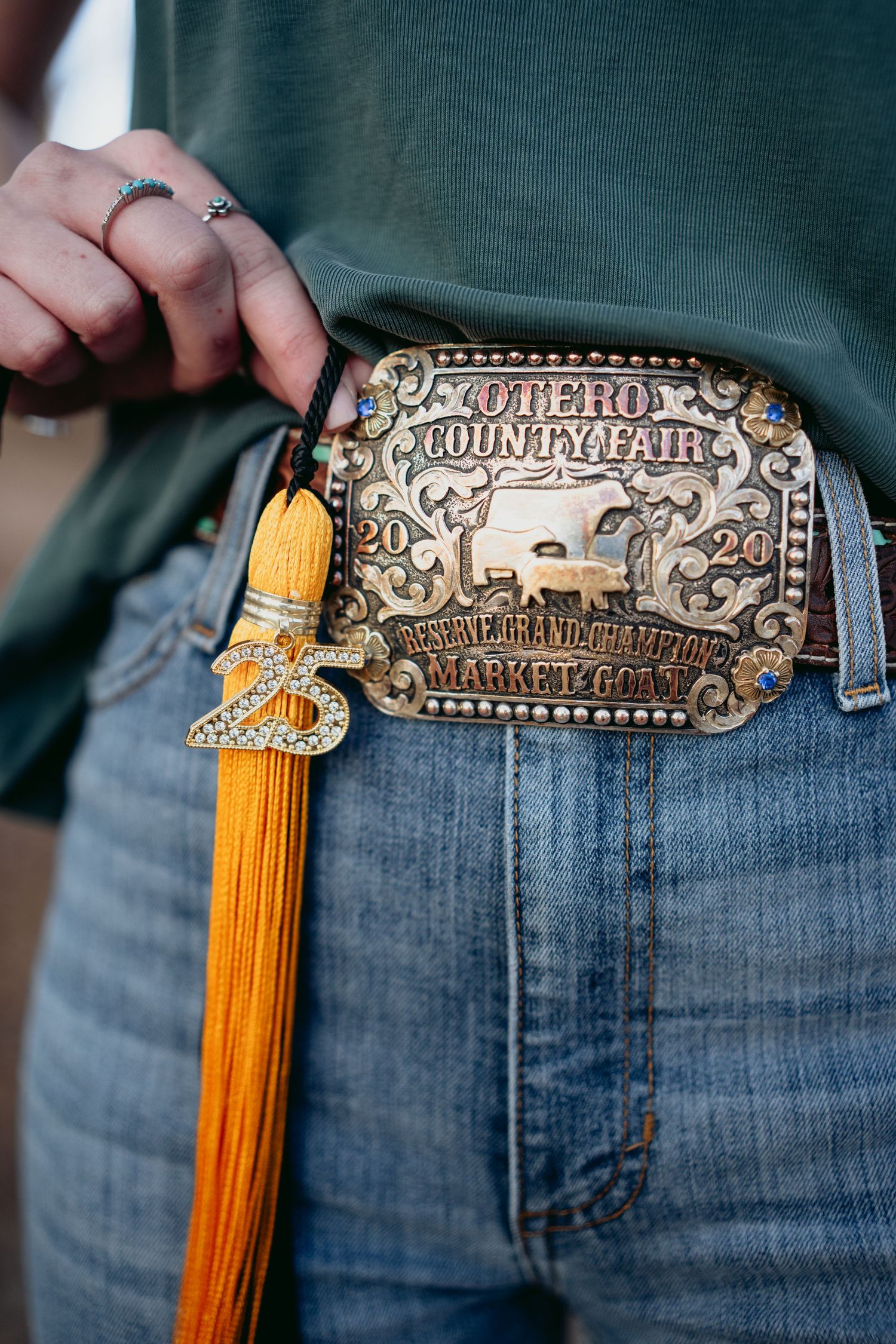 Detail shot of ornate Otero County Fair 2024 reserve grand champion rodeo belt buckle.