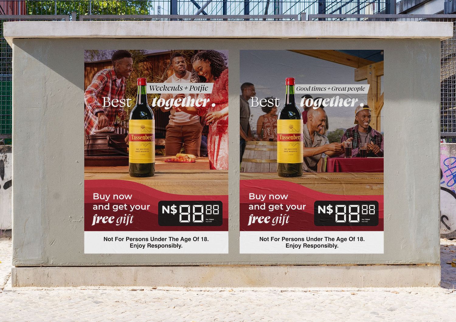 Two identical wine advertisements on a bus shelter promoting a free gift offer, featuring a red wine bottle and dining scene.