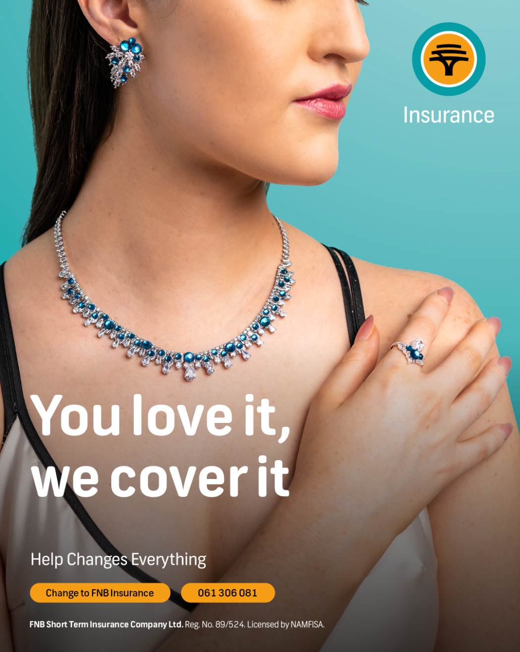 FNB Insurance ad featuring a woman wearing a blue diamond necklace and ring set with the tagline You love it, we cover it.