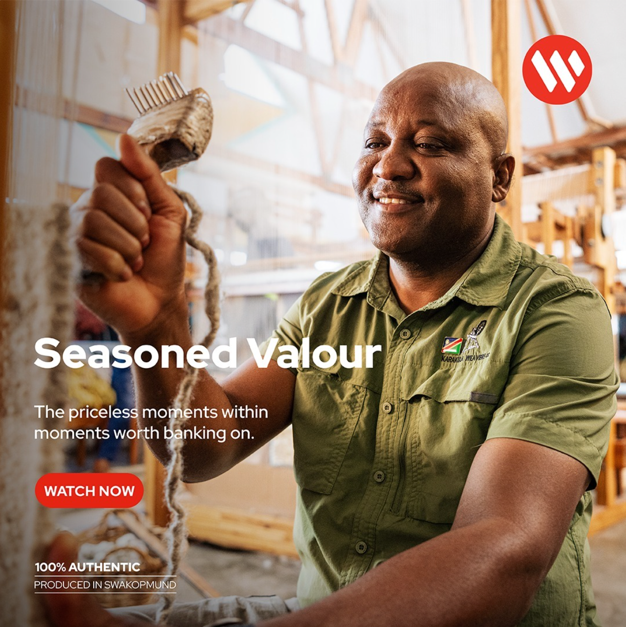 Smiling African man in green shirt holds dried fish, featured in Seasoned Valour campaign by Wits University.