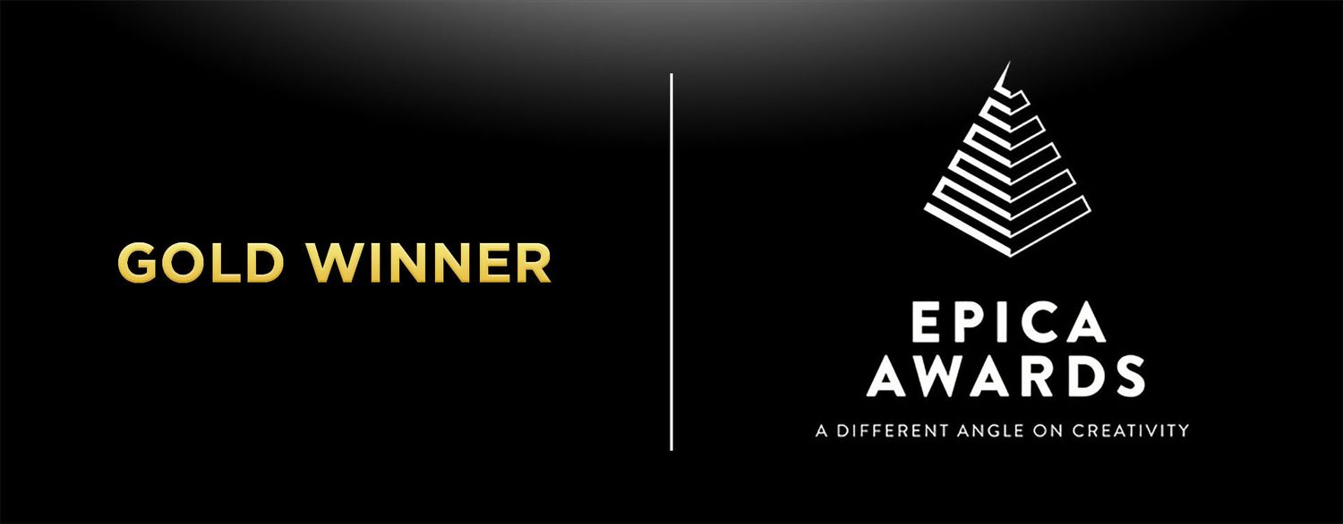 Gold Winner badge from Epica Awards, a prestigious international creativity competition, displayed on a dark background.
