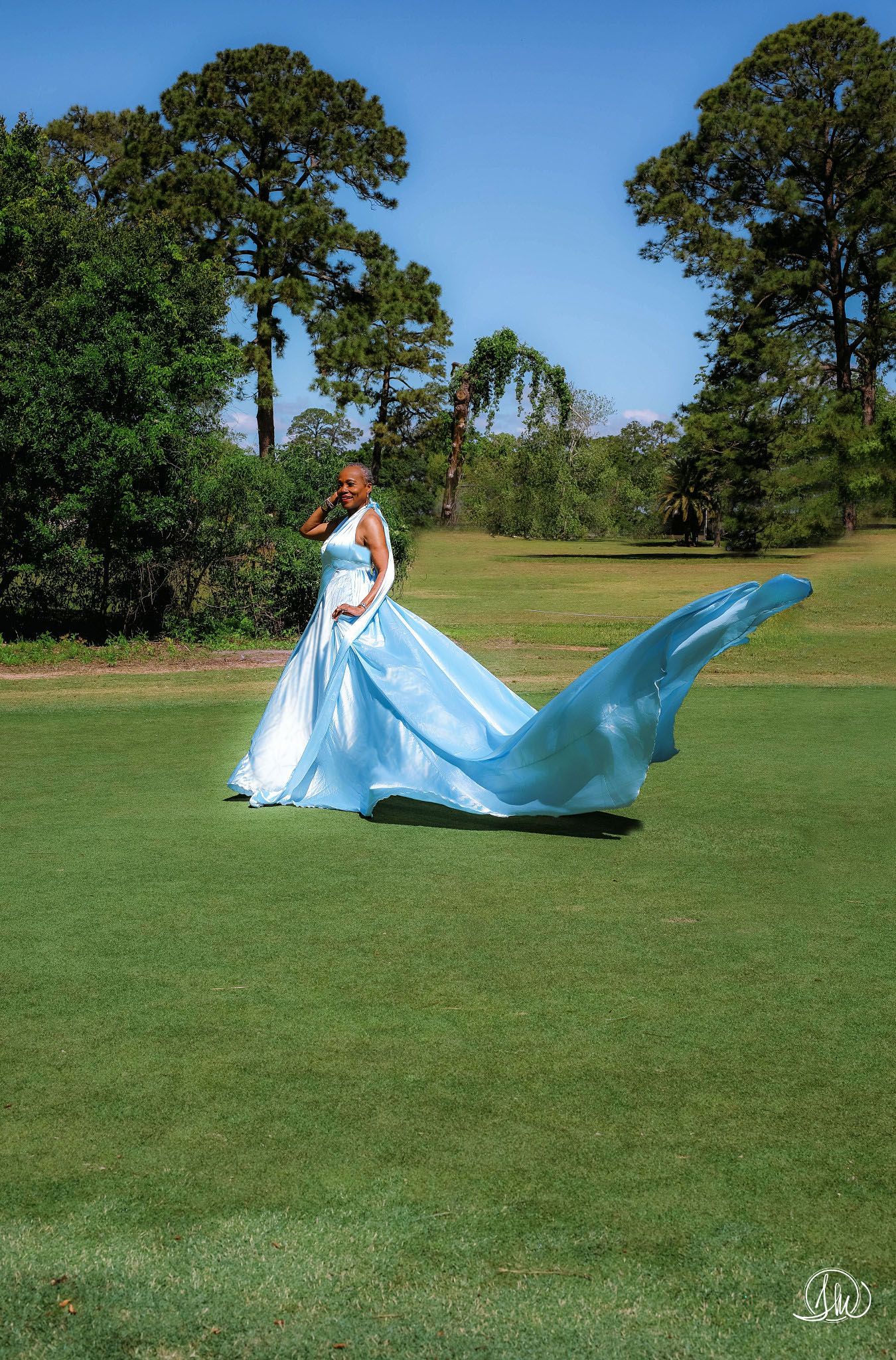 Jacksonville flying dress session - Ice Whisper blue gown on golf course