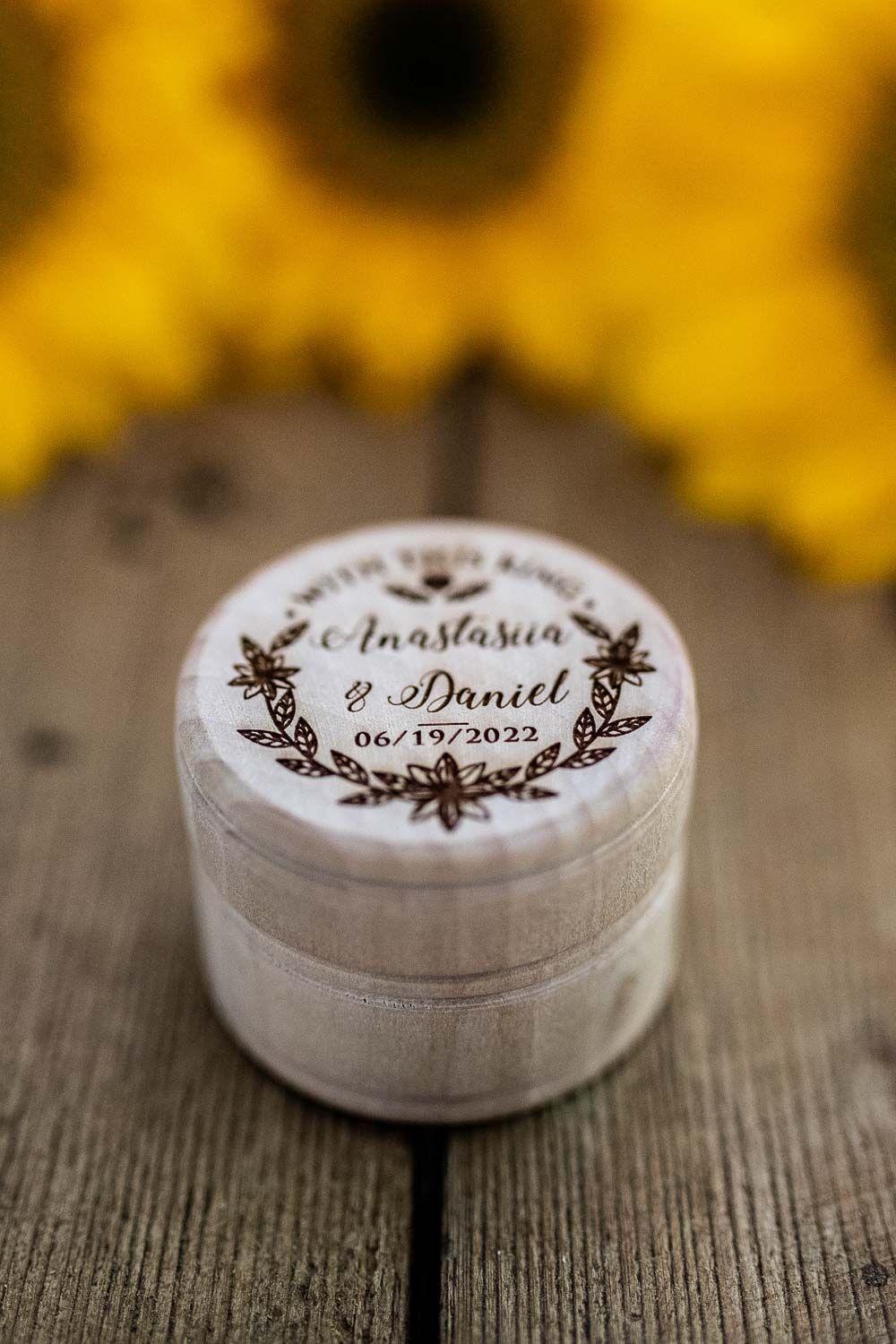 Rustic wooden ring box engraved with Anastasia and Daniel wedding date 06/19/2022.