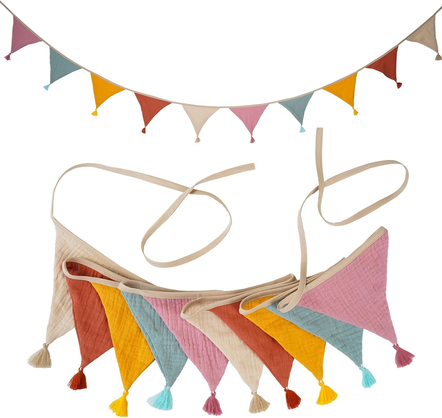 Colorful triangle bunting banner with tassels and pom poms in pastel pink, yellow, blue and orange for party decoration.
