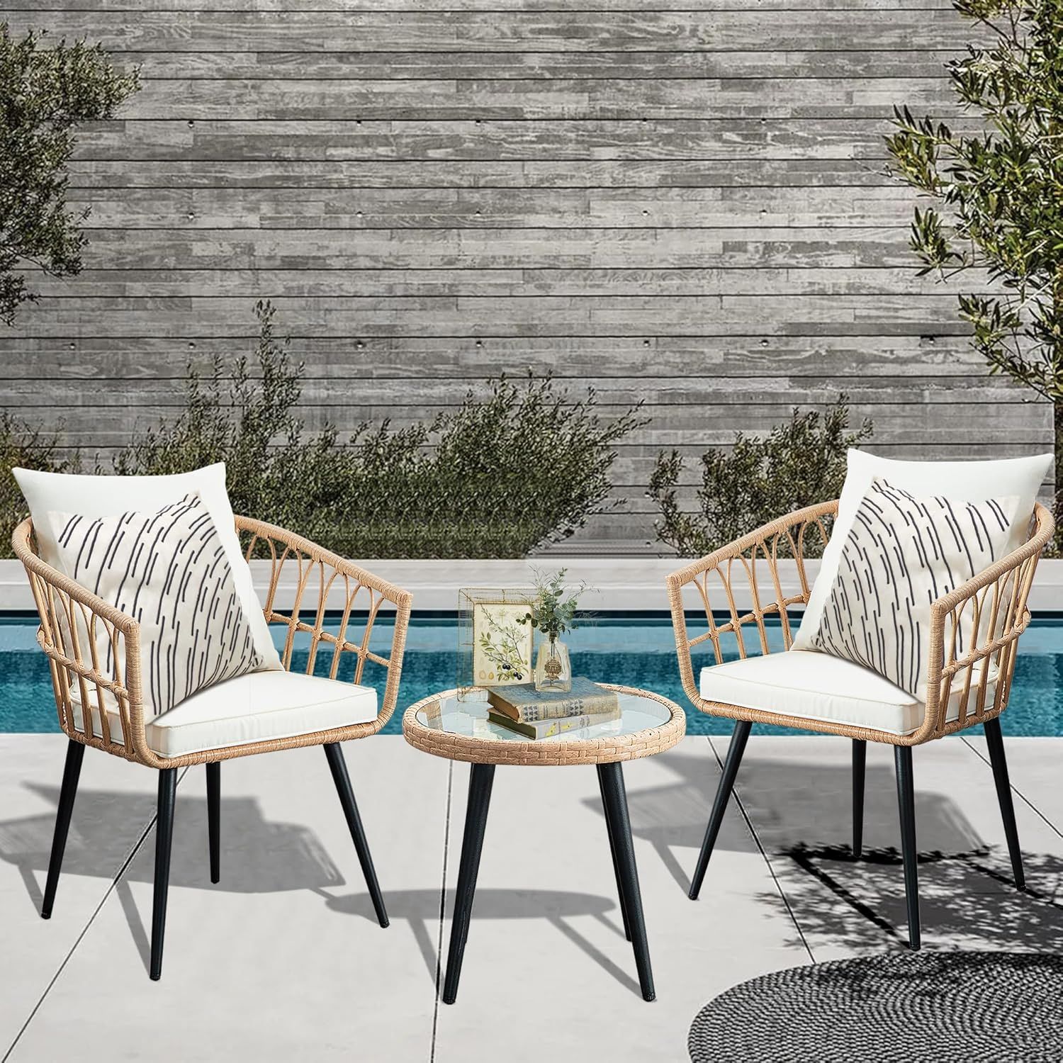 White cushioned bamboo accent chair with black metal legs shown at multiple angles for product display.