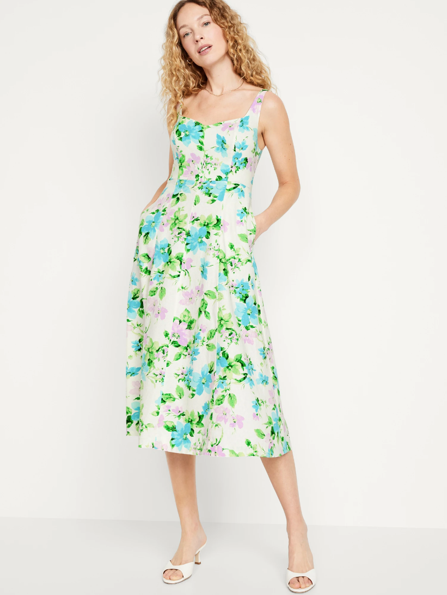 Floral print midi dress with fitted bodice and full skirt in green and white.
