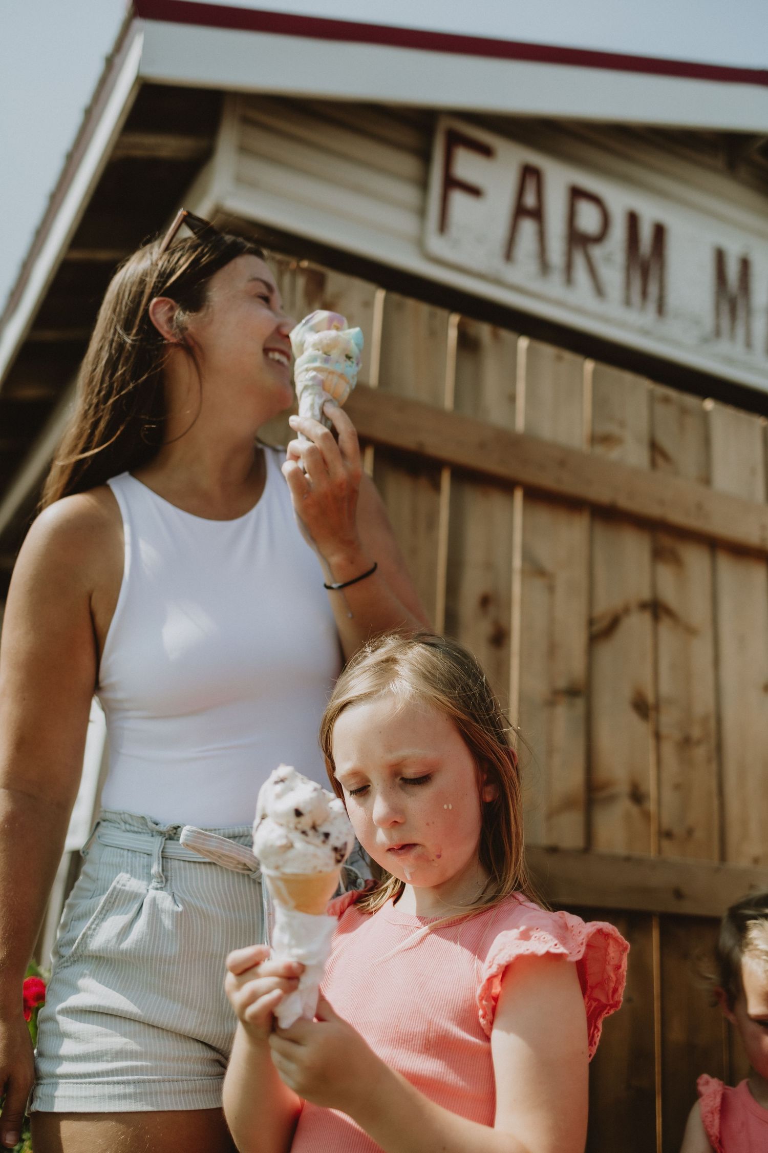 Mom and daughter enjoying ice cream at the Falmouth Farm Market near Windsor Nova Scotia