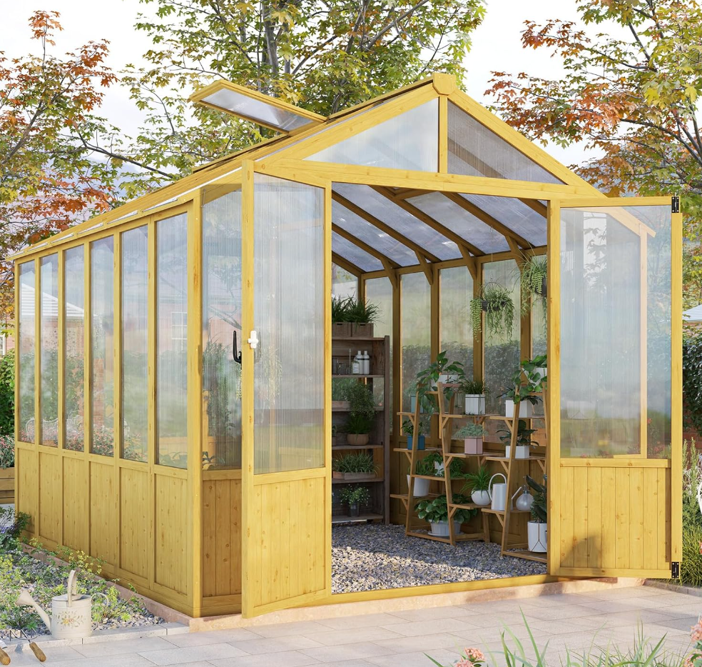 A series of yellow wooden garden greenhouses with glass panels arranged side by side in an outdoor setting with trees.