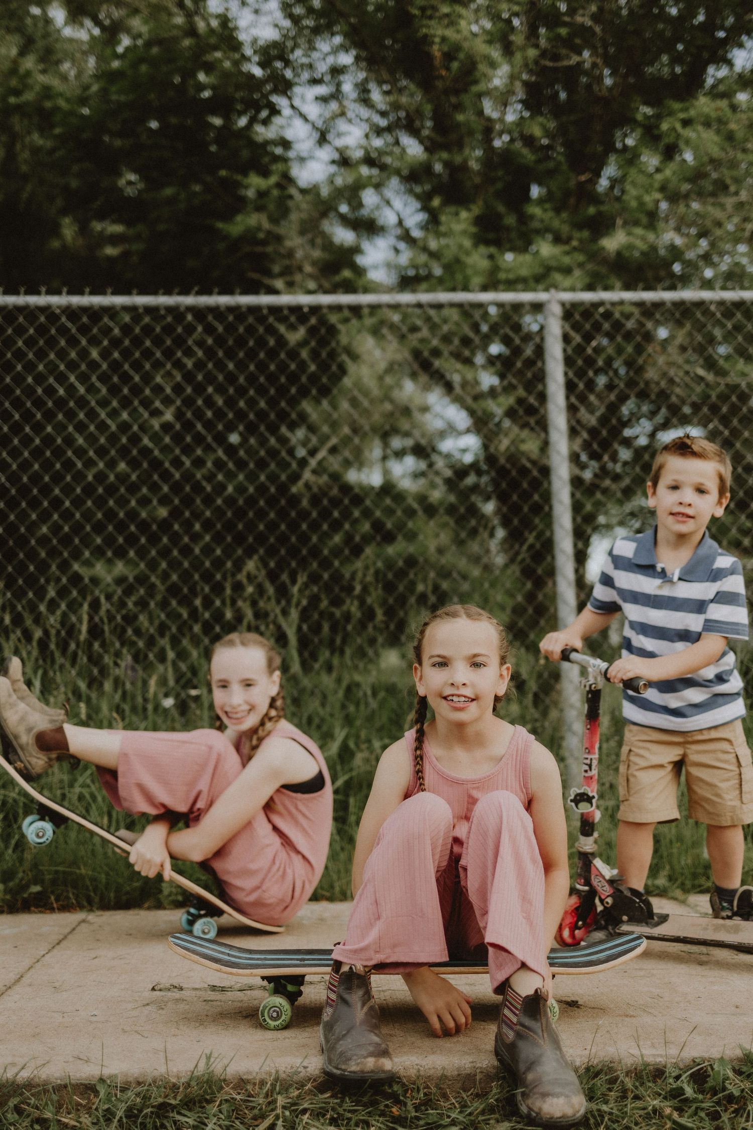 A family enjoying skateboarding together on the walking trail in Windsor Nova Scotia