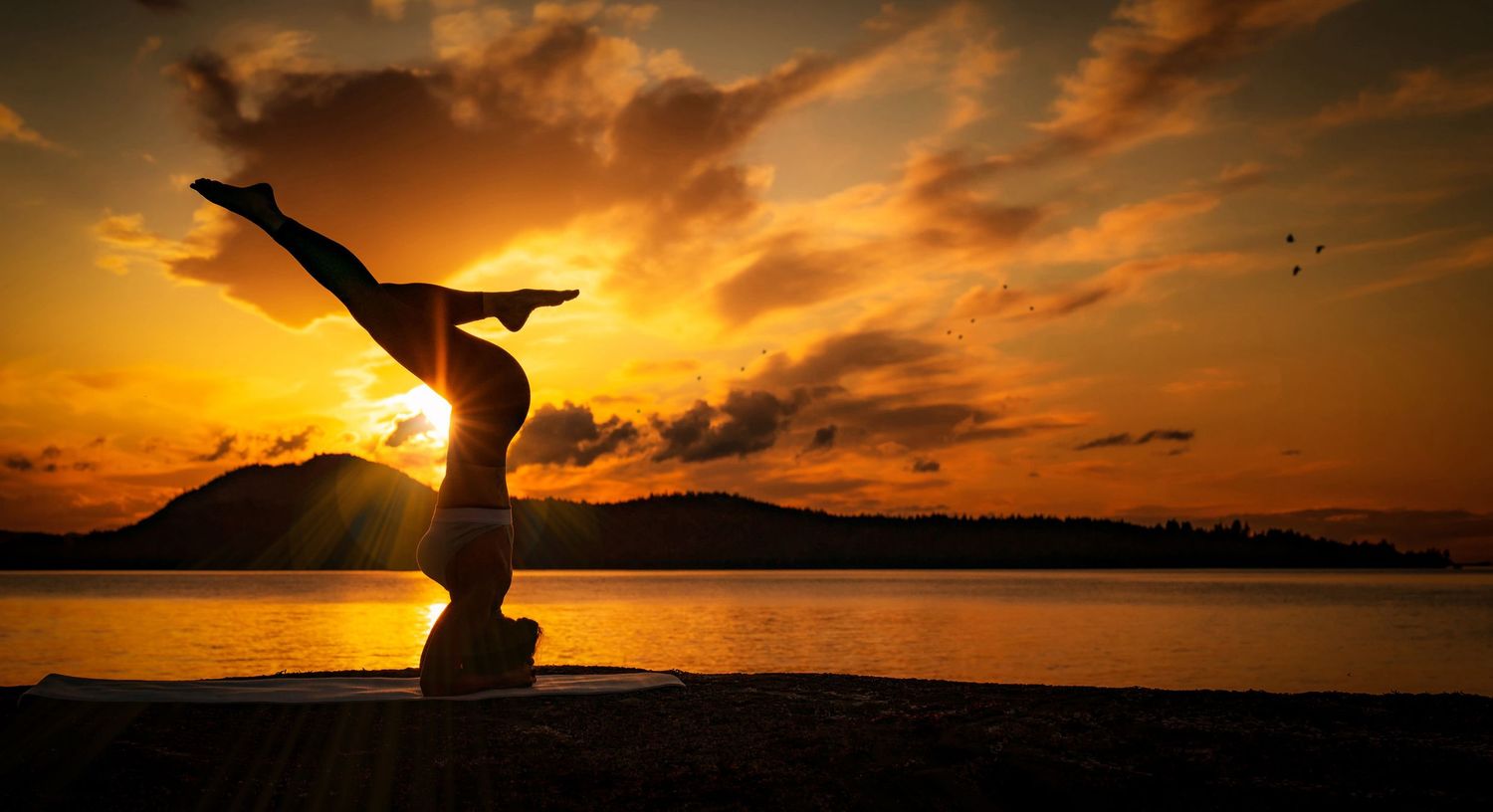 Silhouette of Sarah Gilks @ Sunset doing yoga, photographer Alec Watson