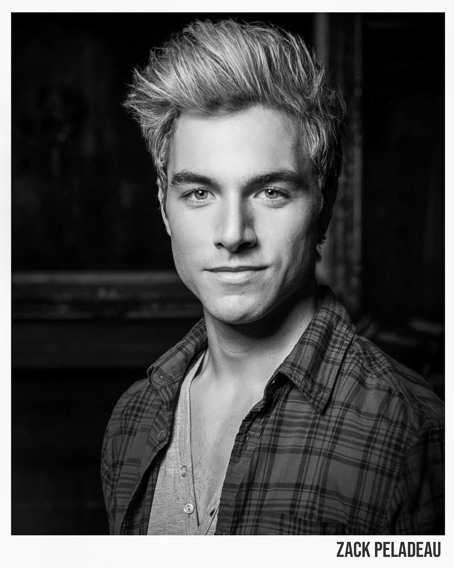 Black and white headshot of a man with styled blonde hair and a serious expression, Zack Peladeau, photographer Alec Watson