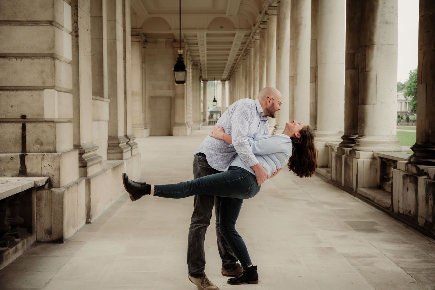 Sequence of dance moves photographed in a classical colonnade hallway.