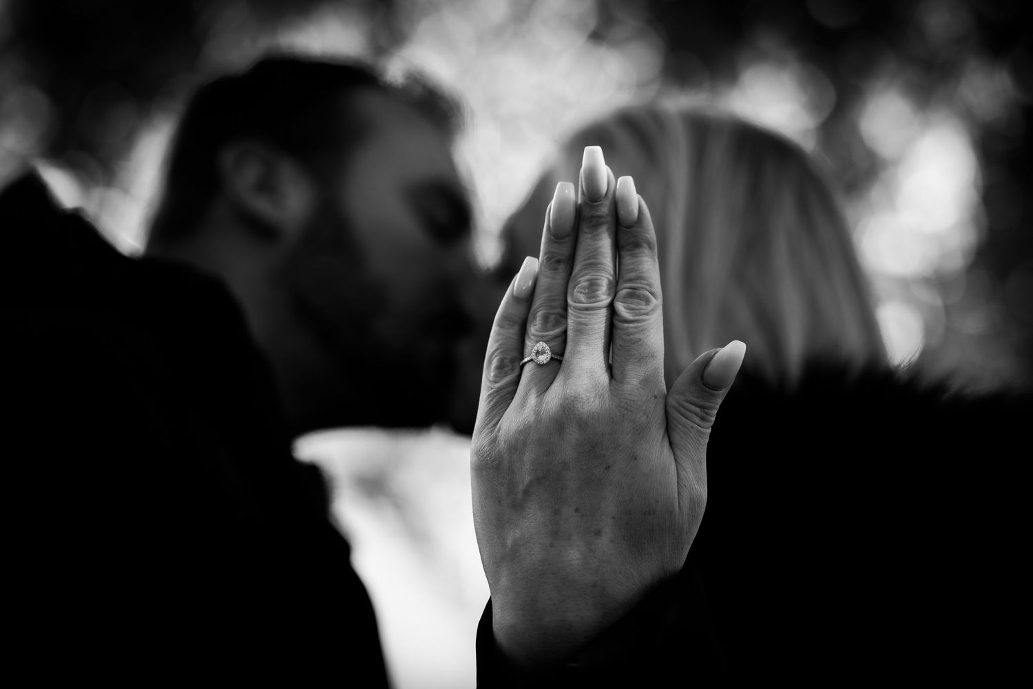 Artistic black and white photo sequence showing hands and intimate gestures.