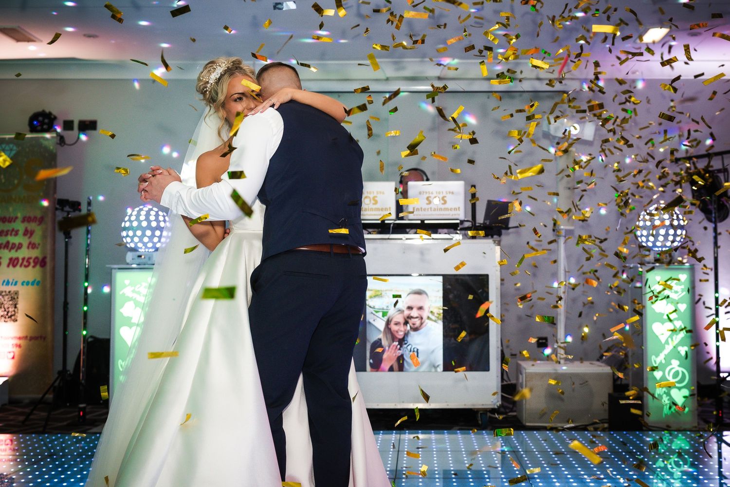 Wedding celebration with colorful confetti falling during a reception party.