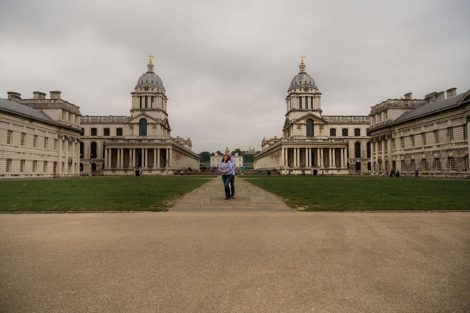 Wide architectural view of Greenwich Naval College with cloudy sky.