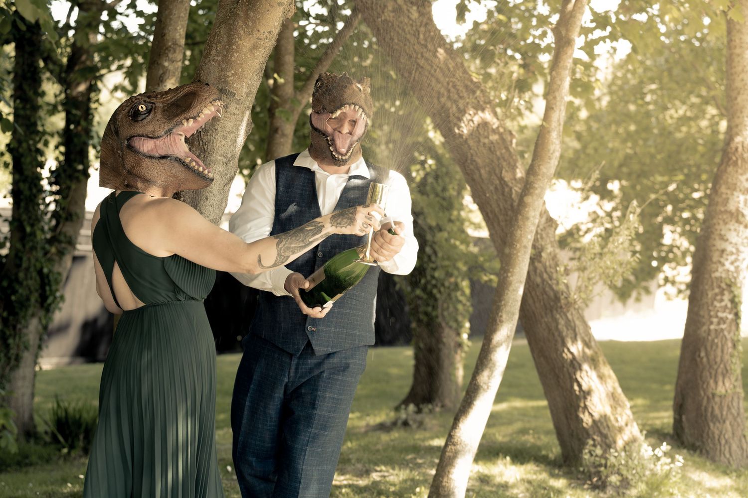 Romantic sunset engagement photos in a tree-lined park setting.