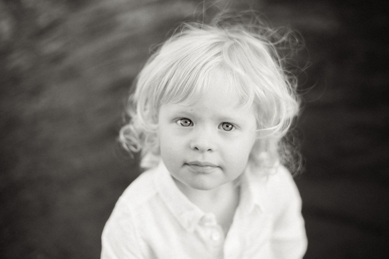 A collection of black and white portraits capturing soft, ethereal expressions.