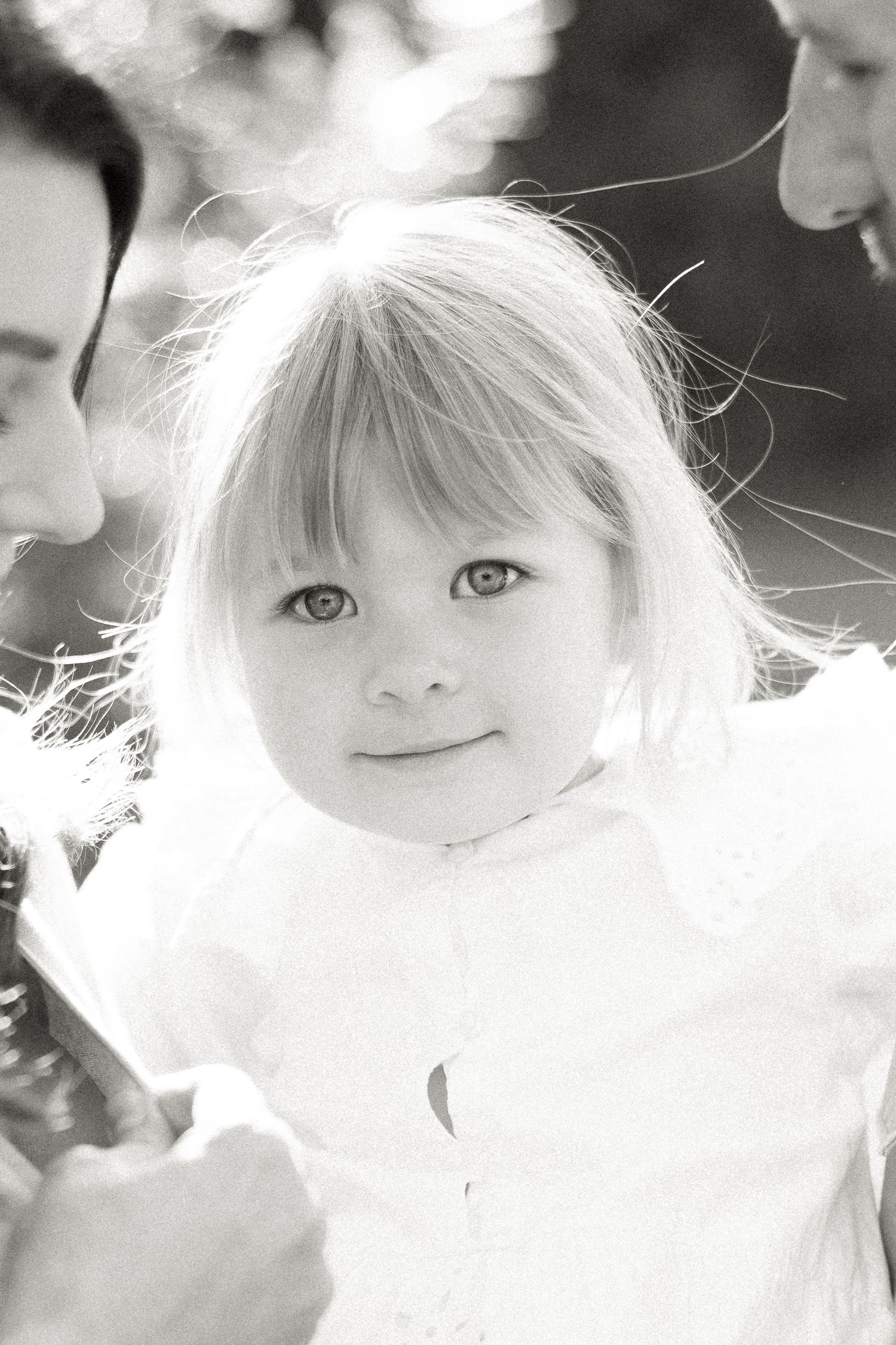 Ethereal black and white portrait with soft backlighting creating a dreamy effect.