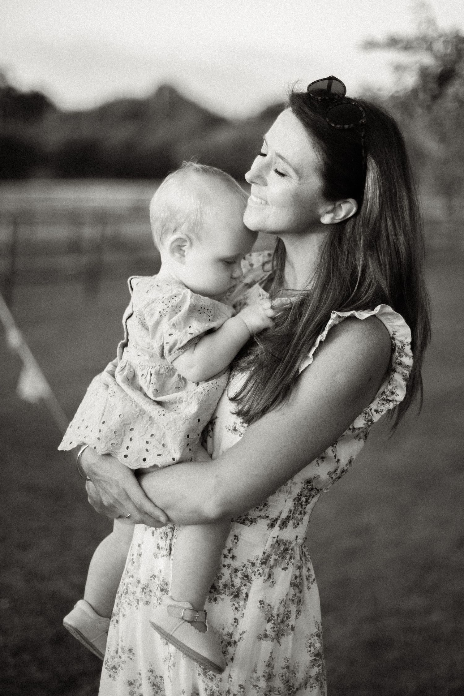 Black and white portrait of tender moments between parent and child.