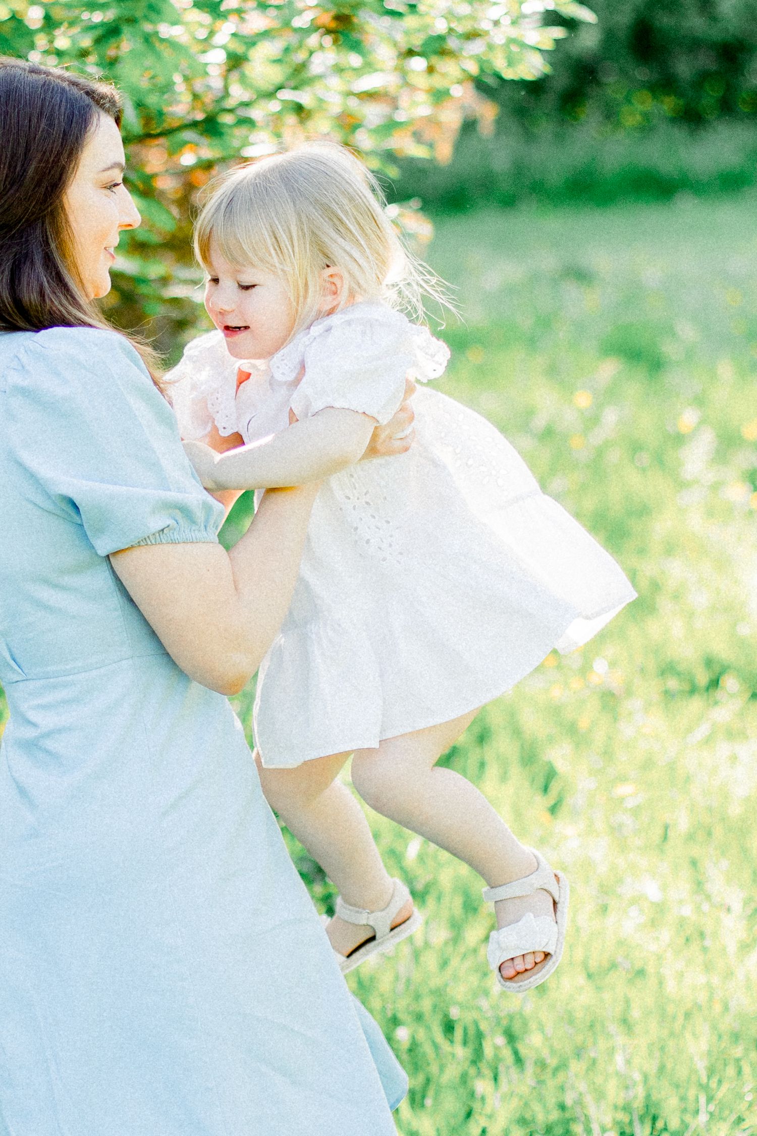 Playful outdoor moments captured against a natural green background.