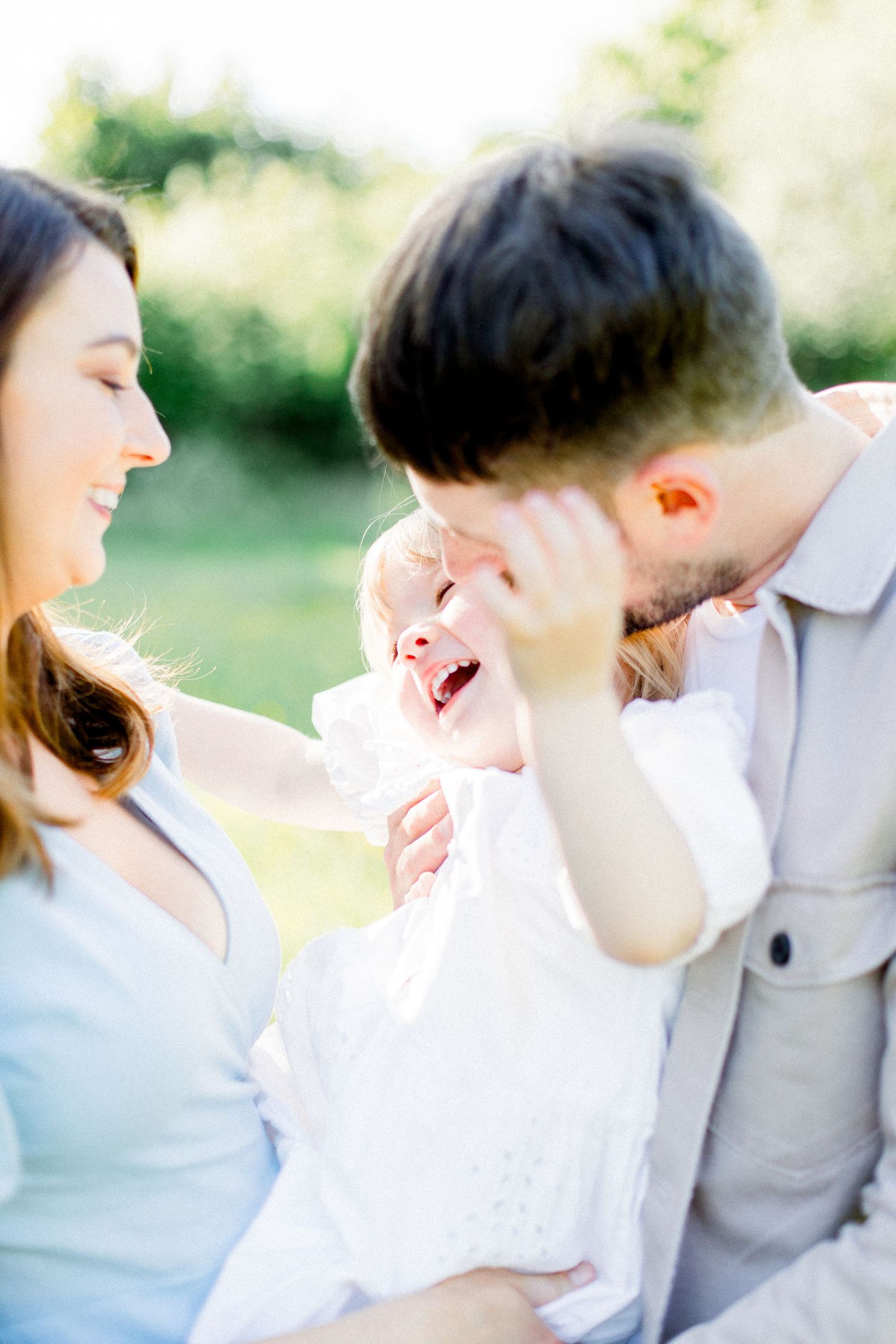 Joyful laughter and embraces shared on a bright sunny day.