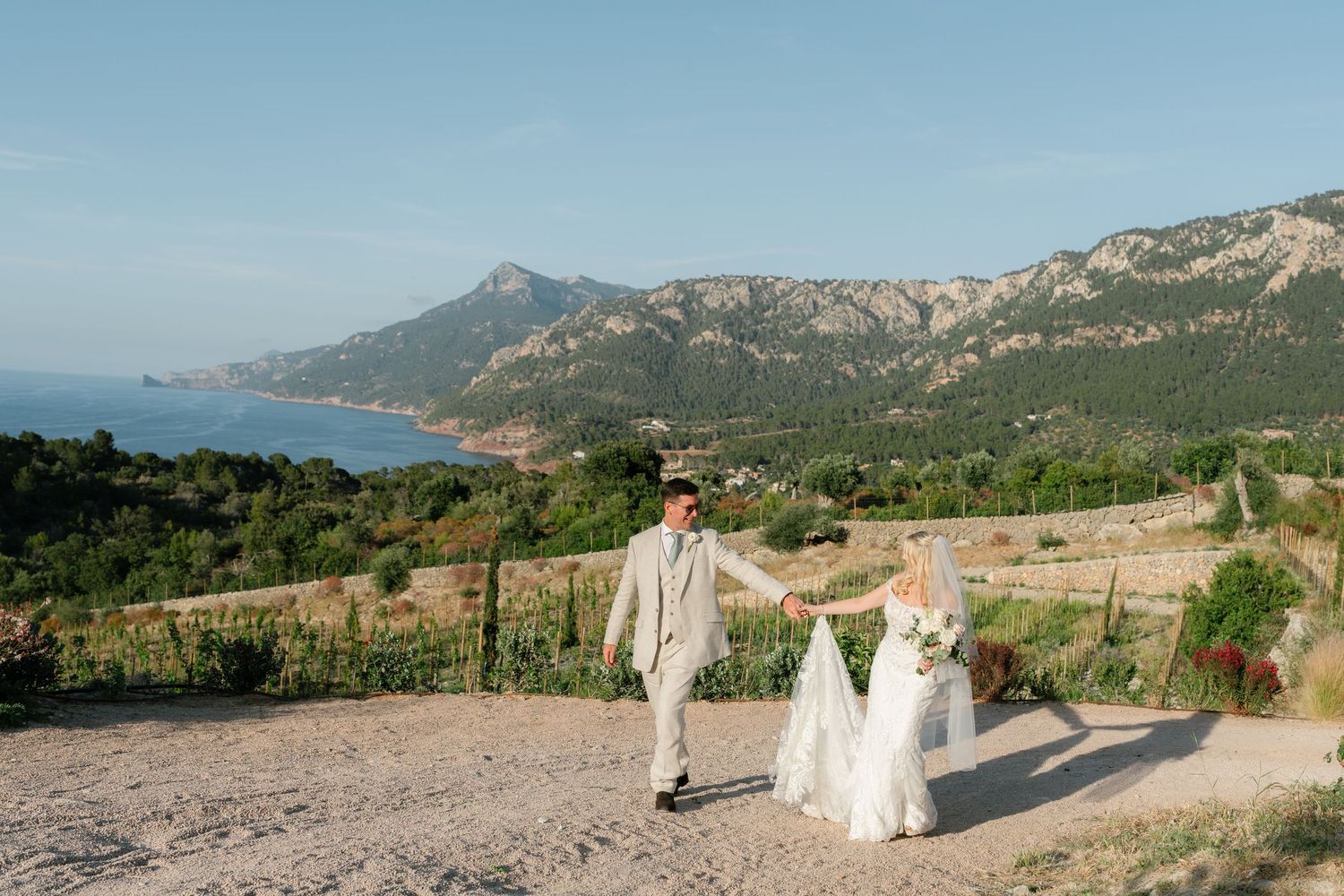Panoramic mountain view of wedding ceremony location with Mediterranean landscape.