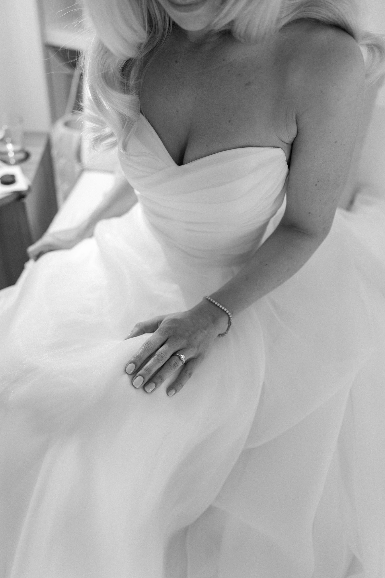 Close-up details of a classic white wedding gown with sweetheart neckline.