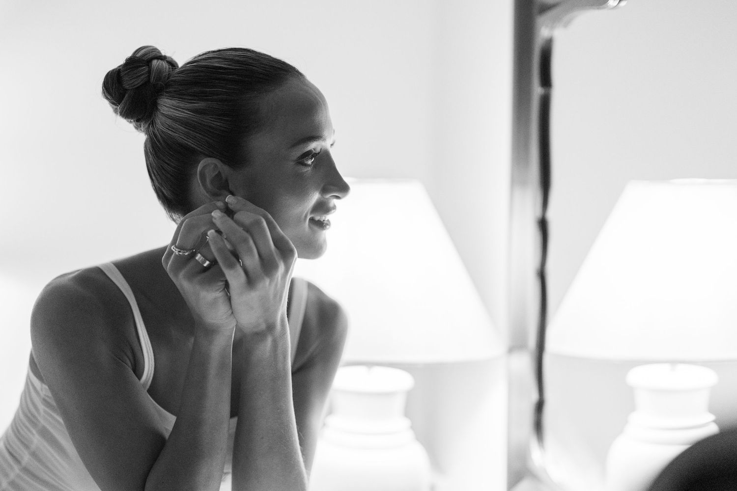 A black and white photo collage showing a woman in profile view looking pensive and emotional.