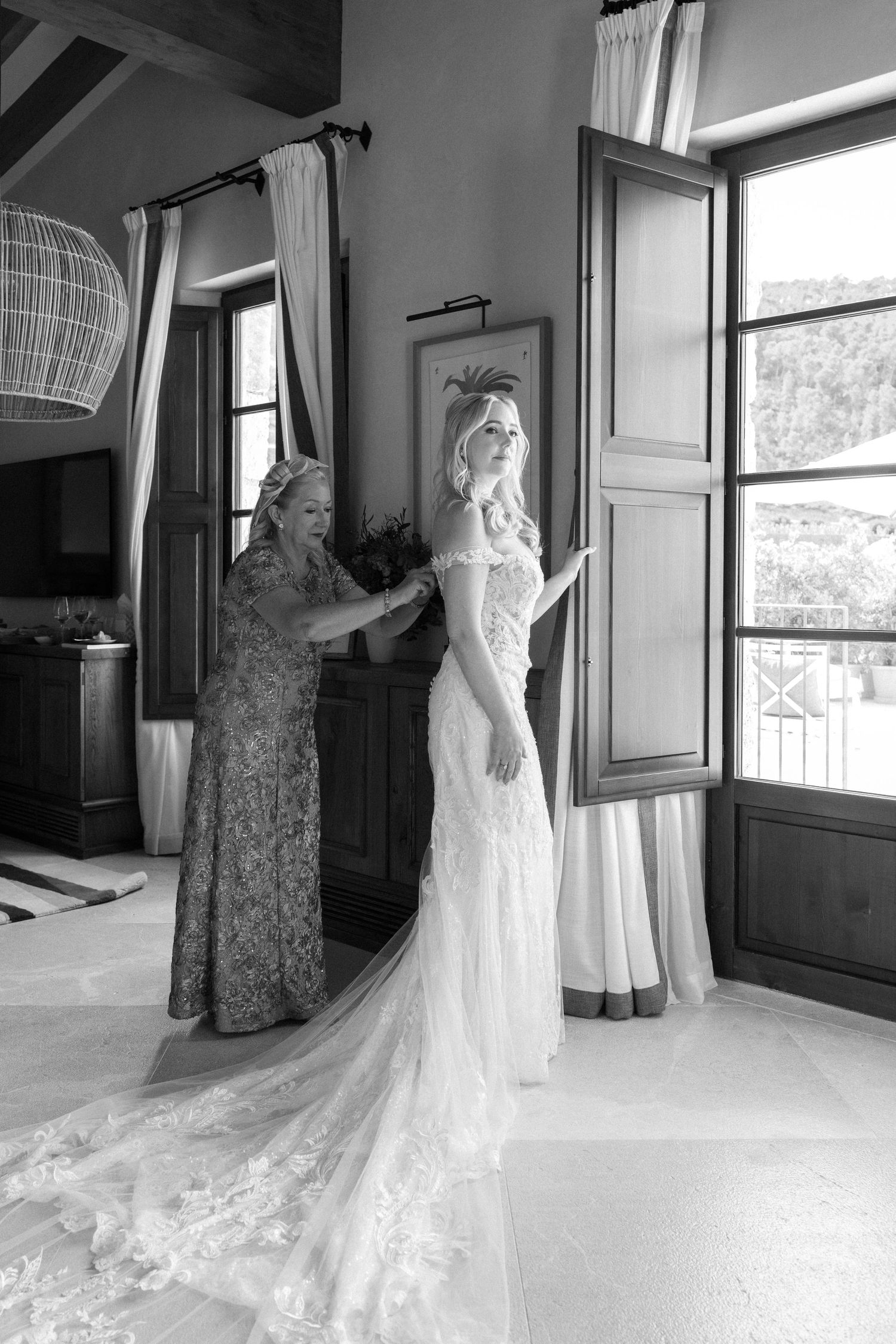 Black and white wedding preparation sequence showing dress details in elegant room.