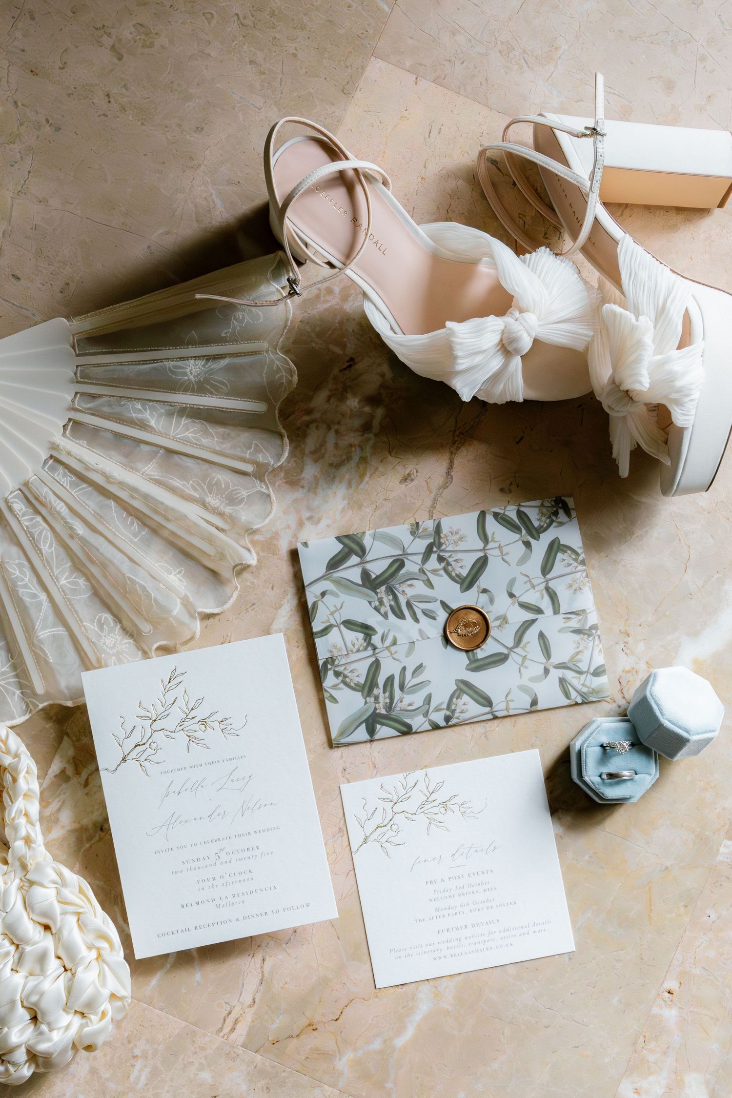 Wedding stationery and invitation suite with elegant calligraphy and floral designs in soft neutral tones.