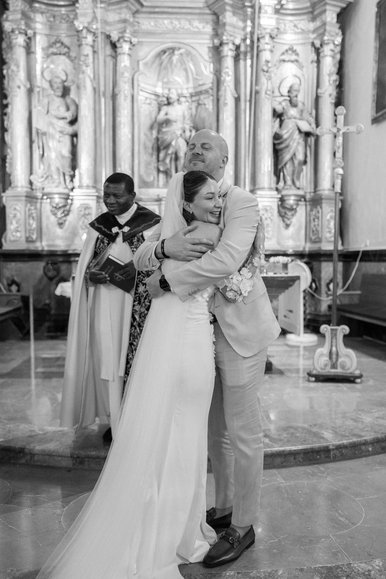 Black and white photos of a wedding ceremony in an ornate baroque church interior.