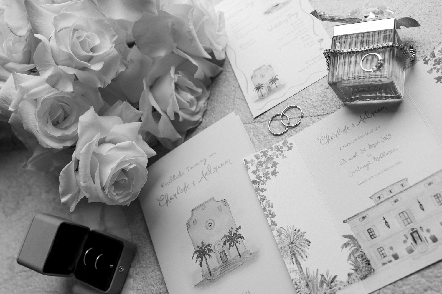 Wedding stationery with delicate floral designs and palm tree illustrations.