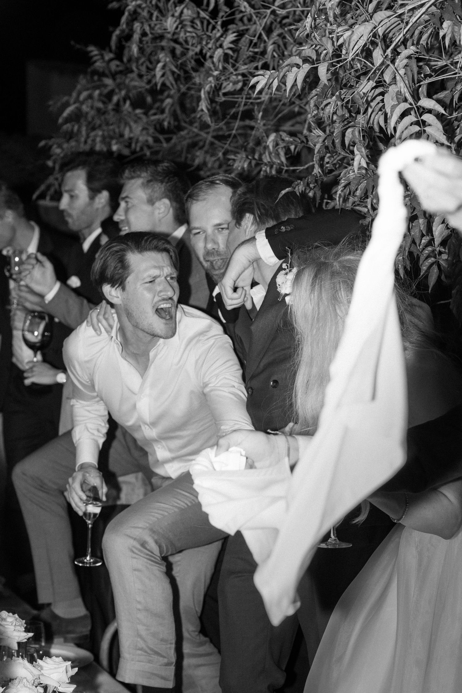 Guests enjoying themselves on the dance floor at a wedding reception.