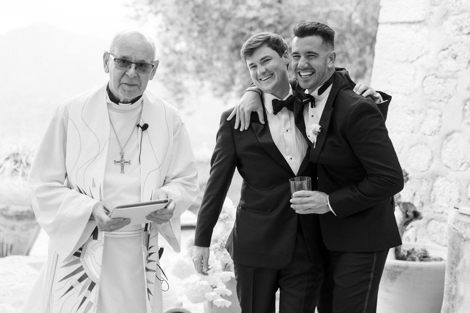 A black and white collage of wedding photos showing candid moments at a formal celebration.