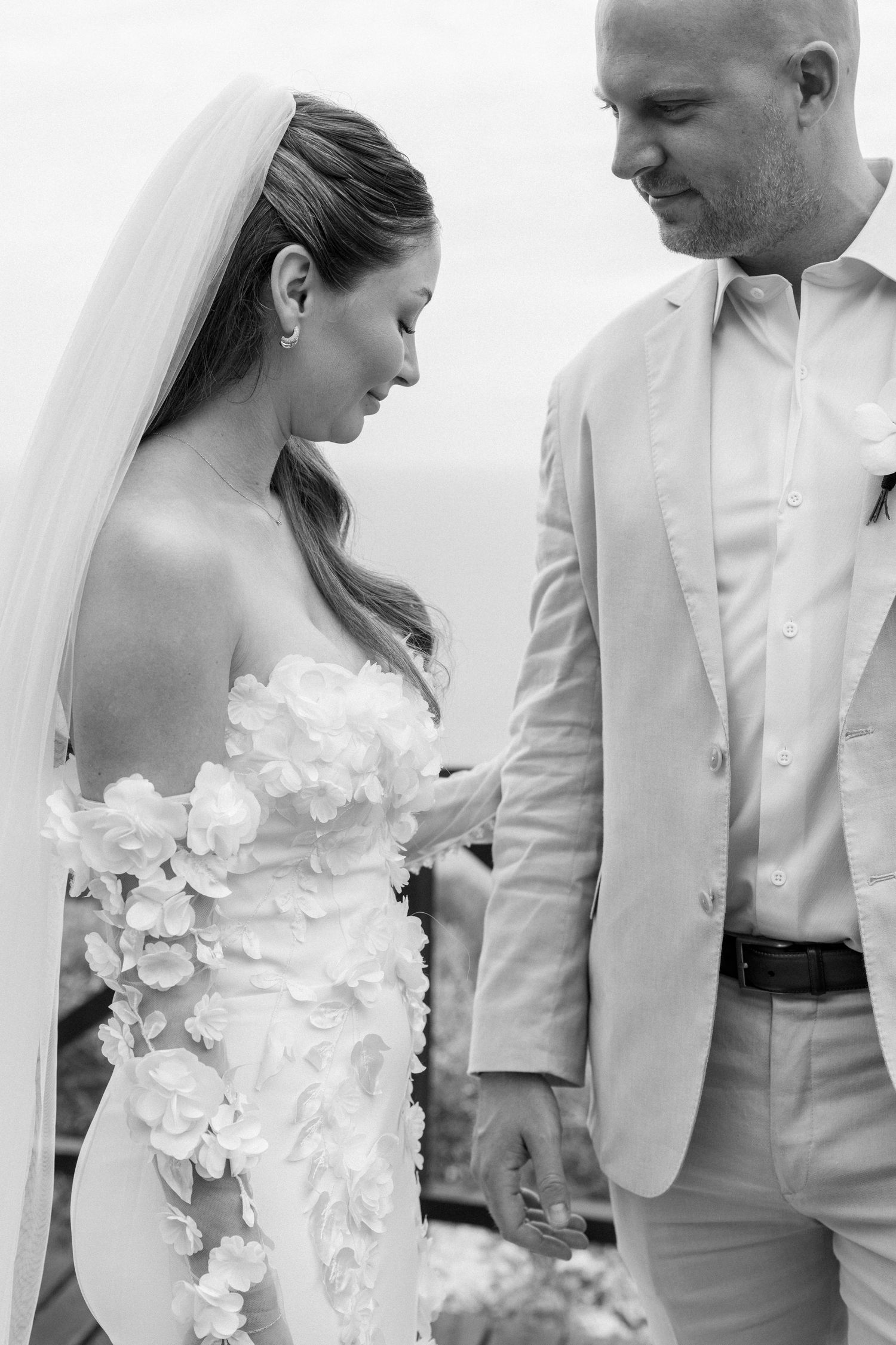 Black and white close-up shots of wedding dress details and intimate moments.