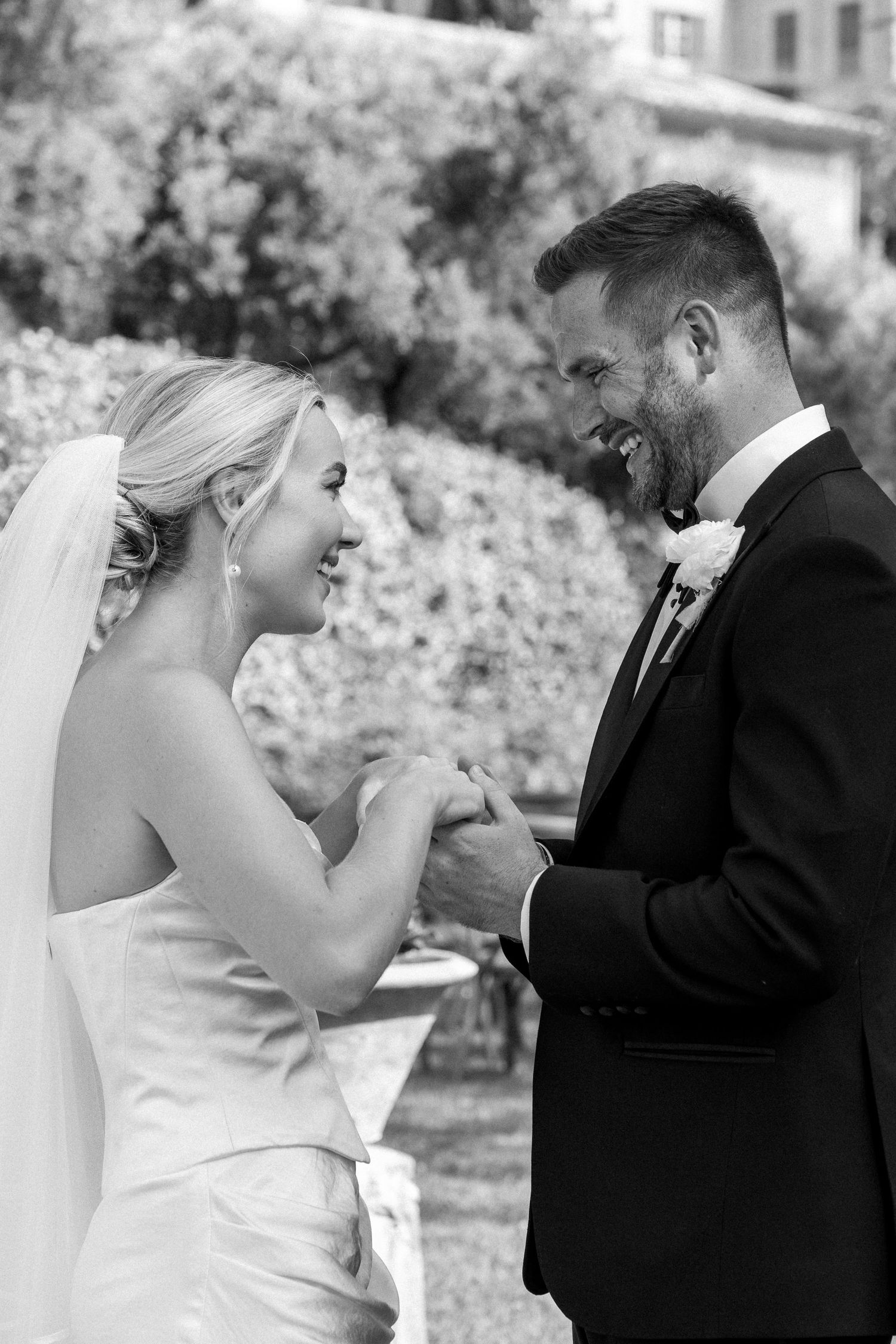 Joyful candid moments between a bride and groom during their wedding celebration.