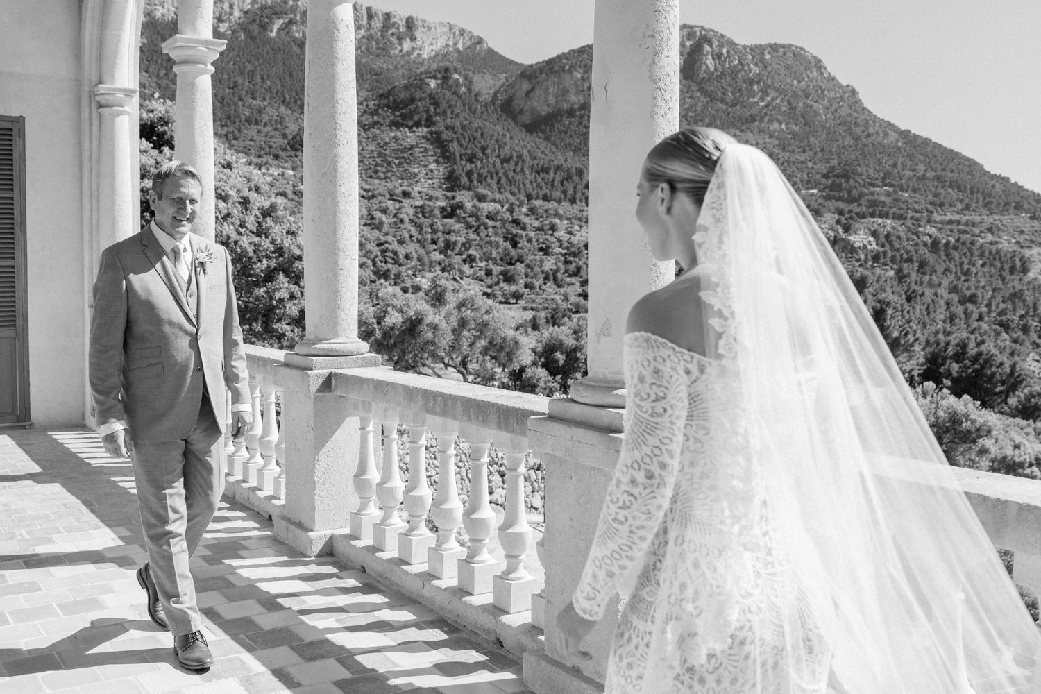 Wedding ceremony preparations at an elegant Mediterranean villa with mountain views.