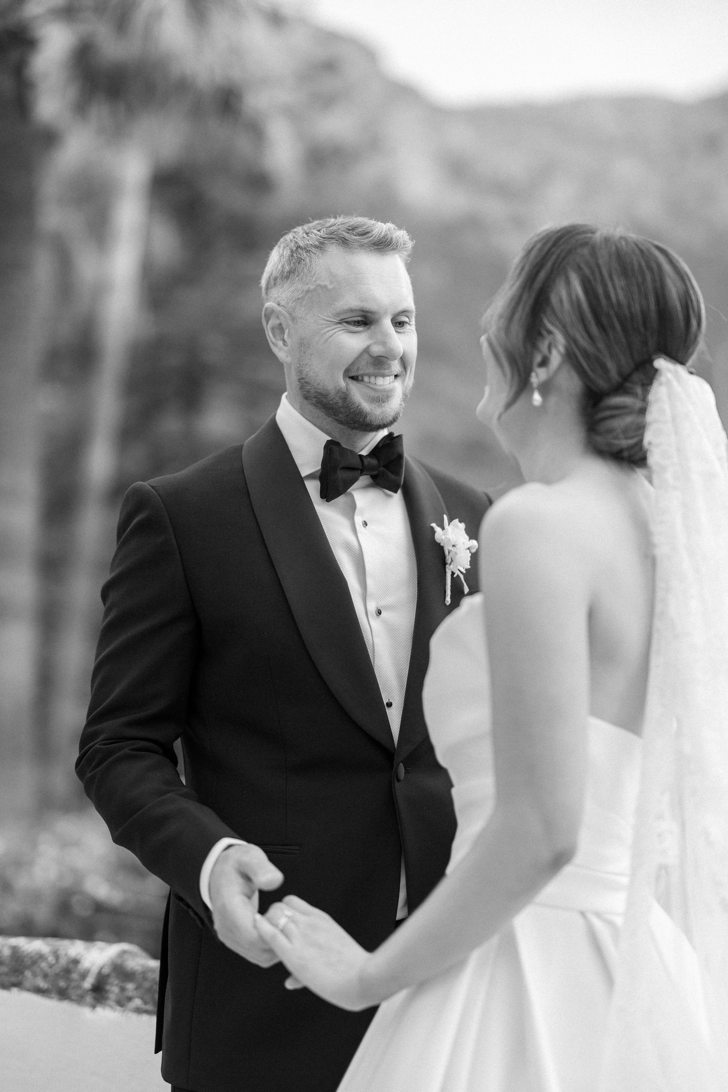 Black and white wedding portraits on a scenic mountain terrace.
