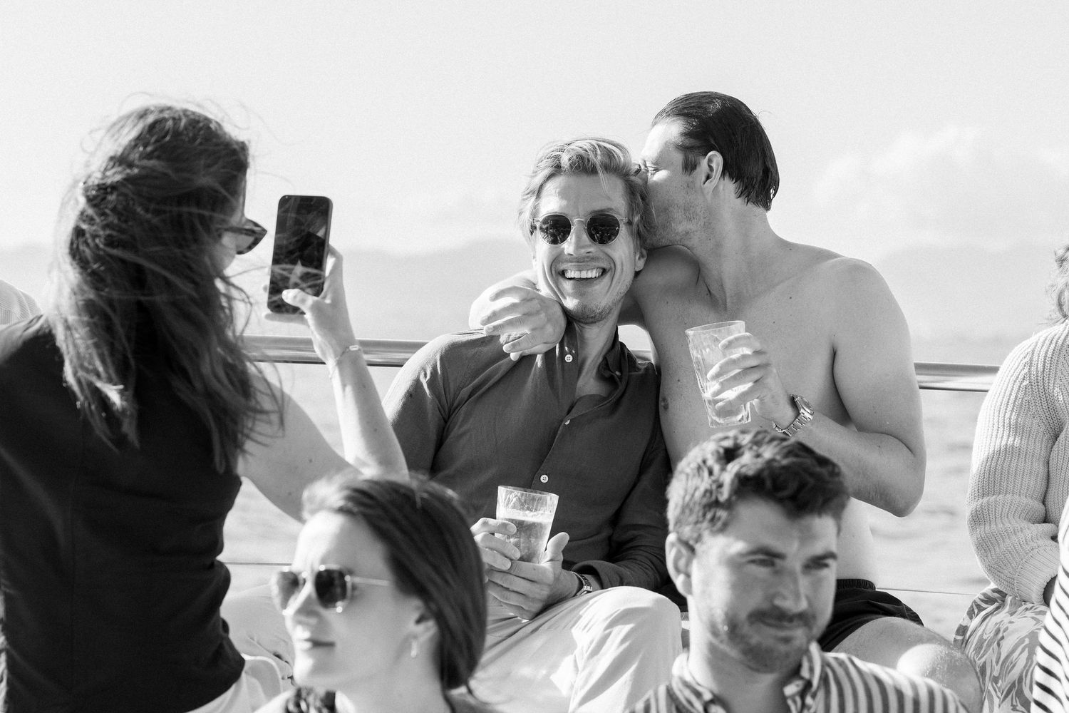 A candid moment of laughter and celebration at an outdoor party.