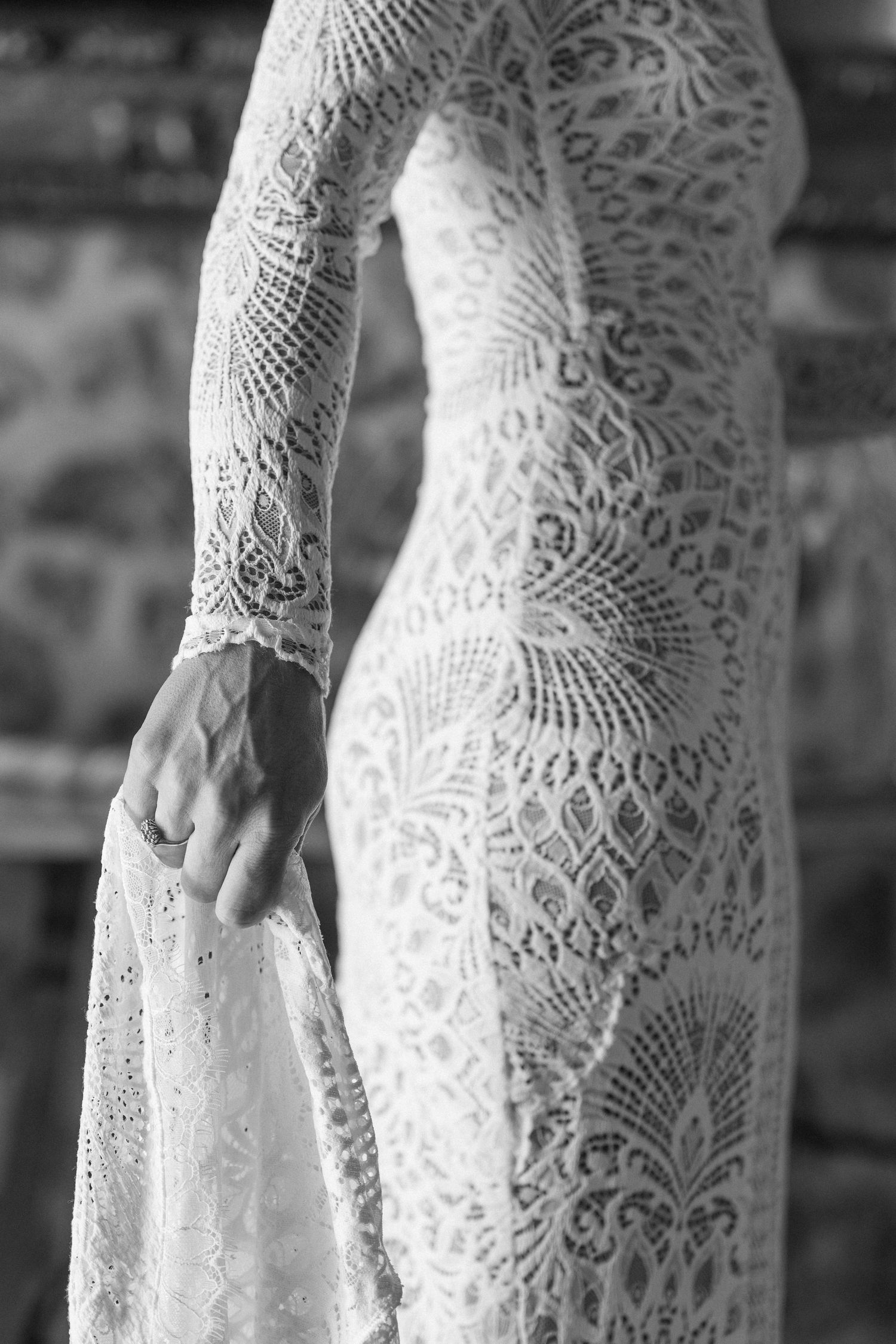 Close-up details of intricate lace patterns on a vintage-style wedding dress.