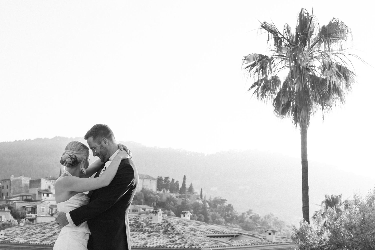Romantic sunset dance sequence overlooking a Mediterranean coastal town.