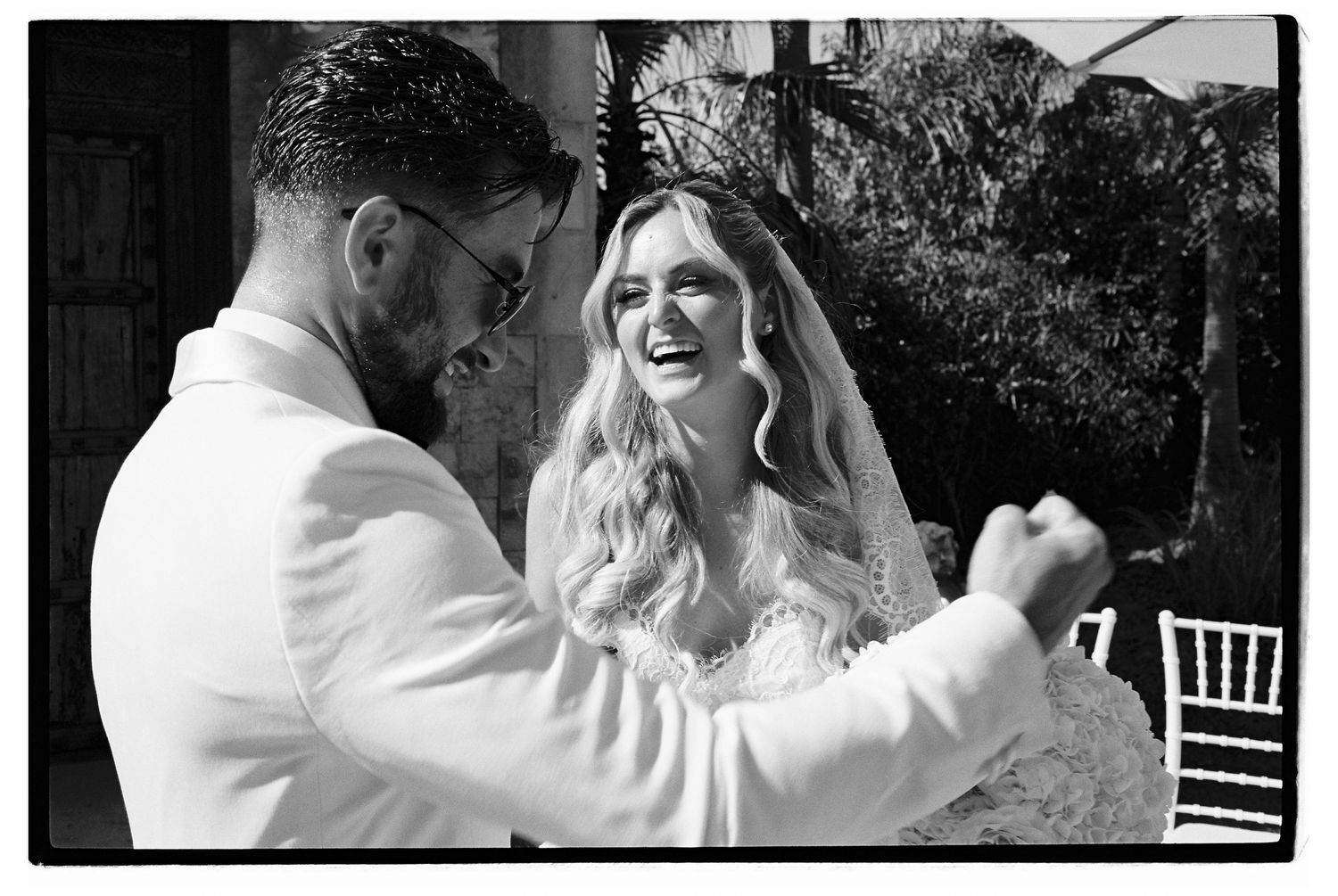 A series of candid wedding moments captured in black and white frames.