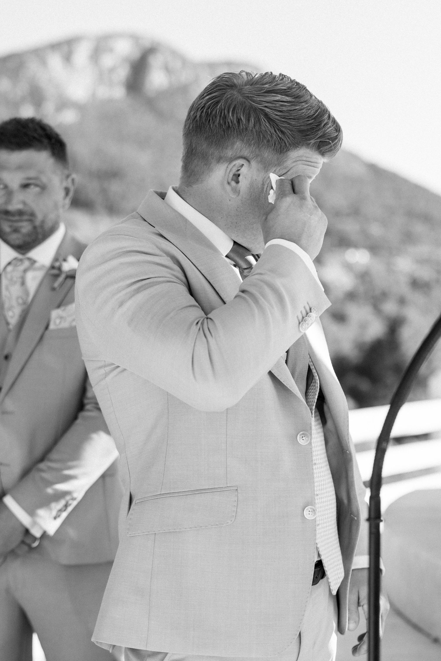 Emotional wedding ceremony moment captured in black and white photography.