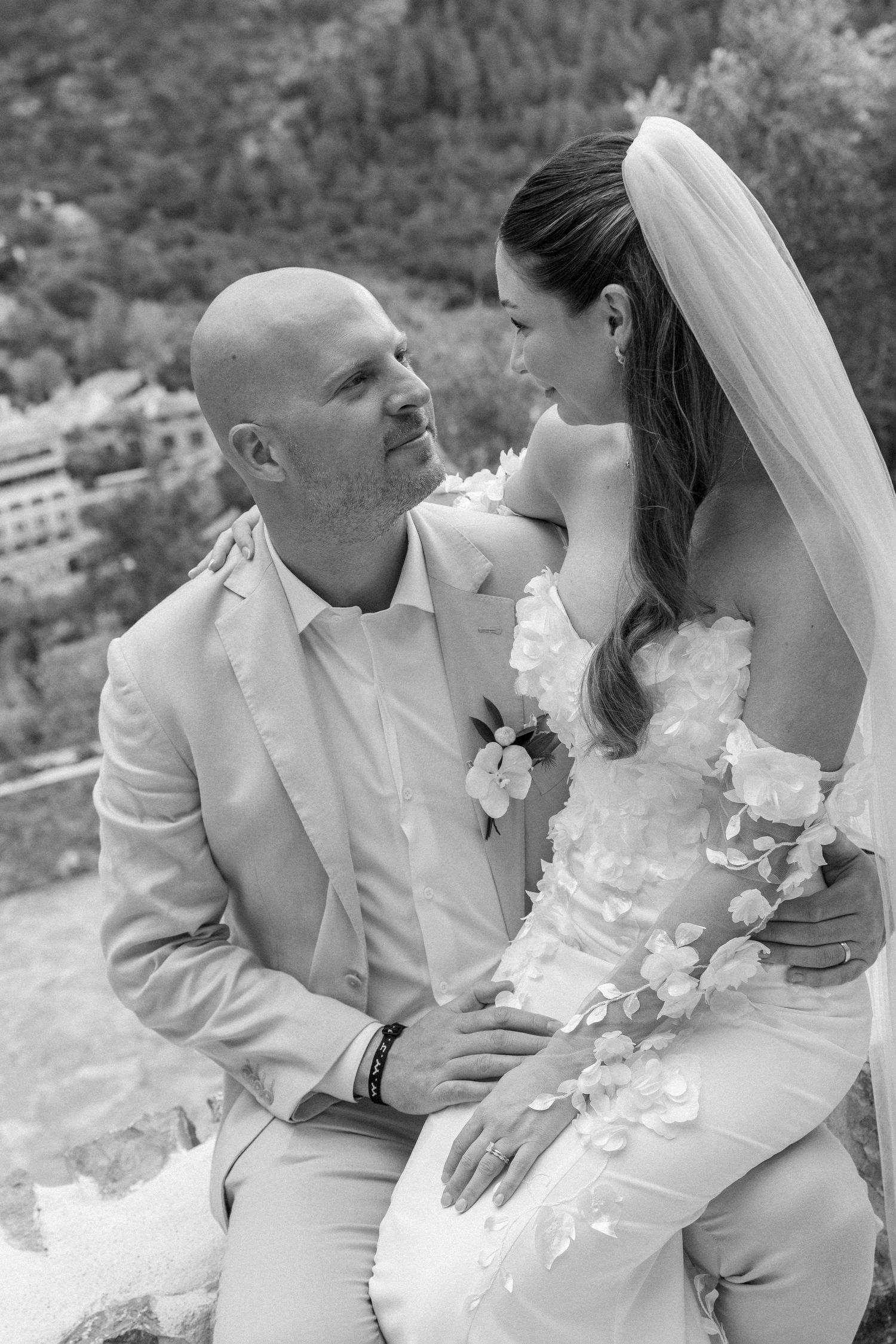 Black and white romantic wedding portraits on scenic mountain overlook.