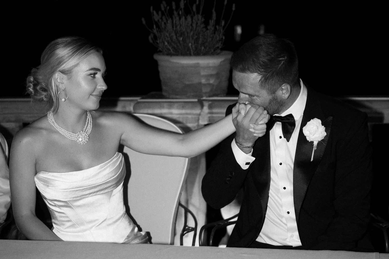 Intimate black and white moments captured during wedding reception.