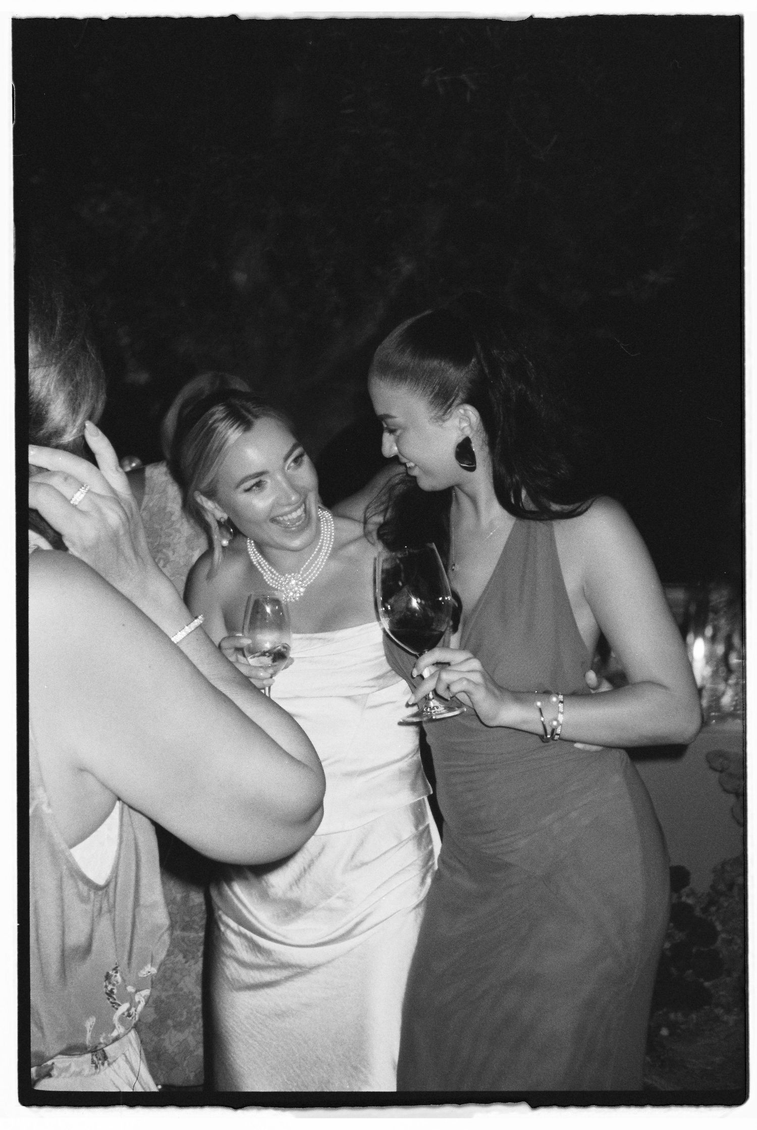 Candid moments of dancing and laughter at a wedding reception.