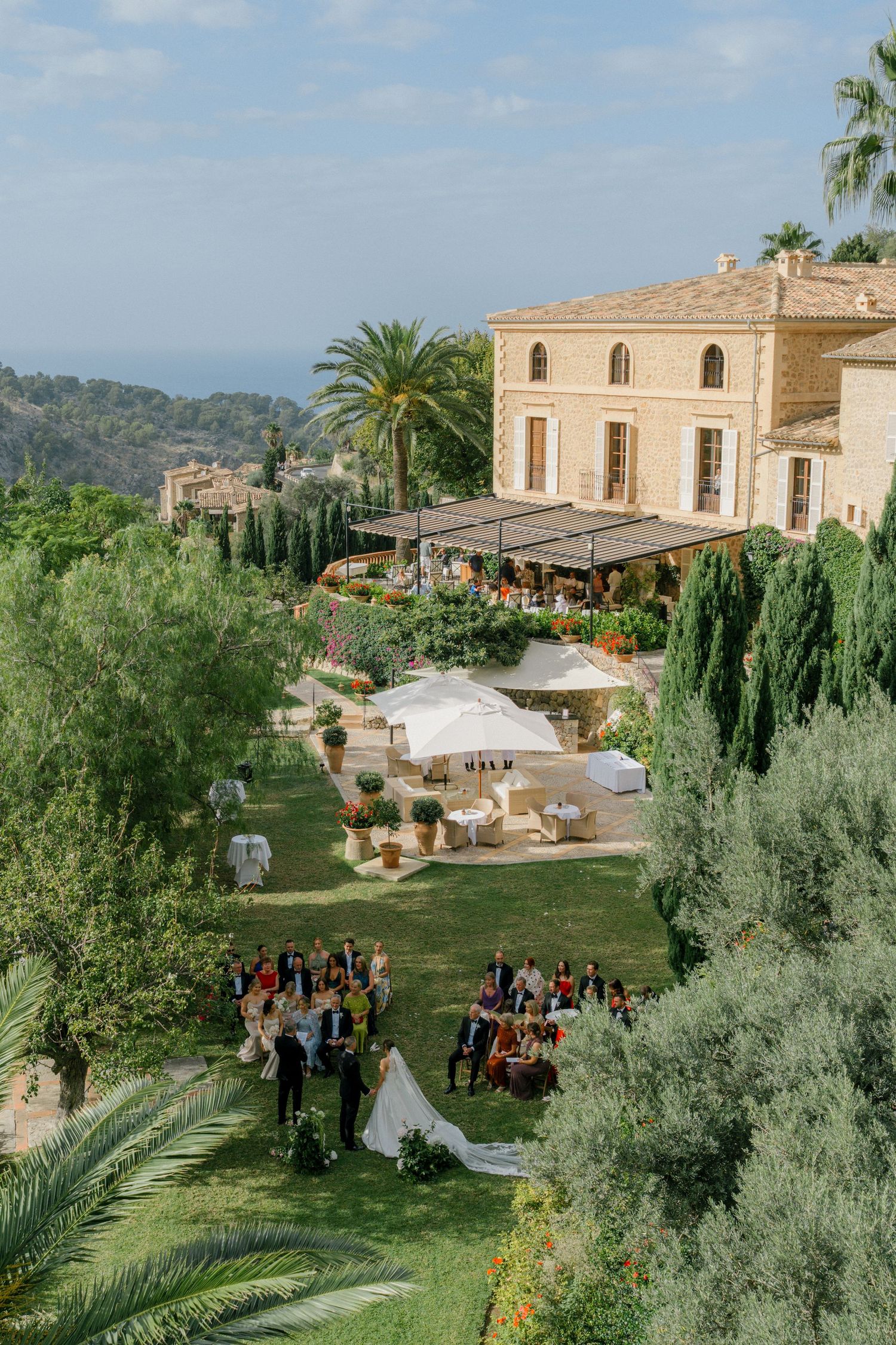 Mediterranean villa wedding venue with lush gardens and mountain views overlooking the sea.