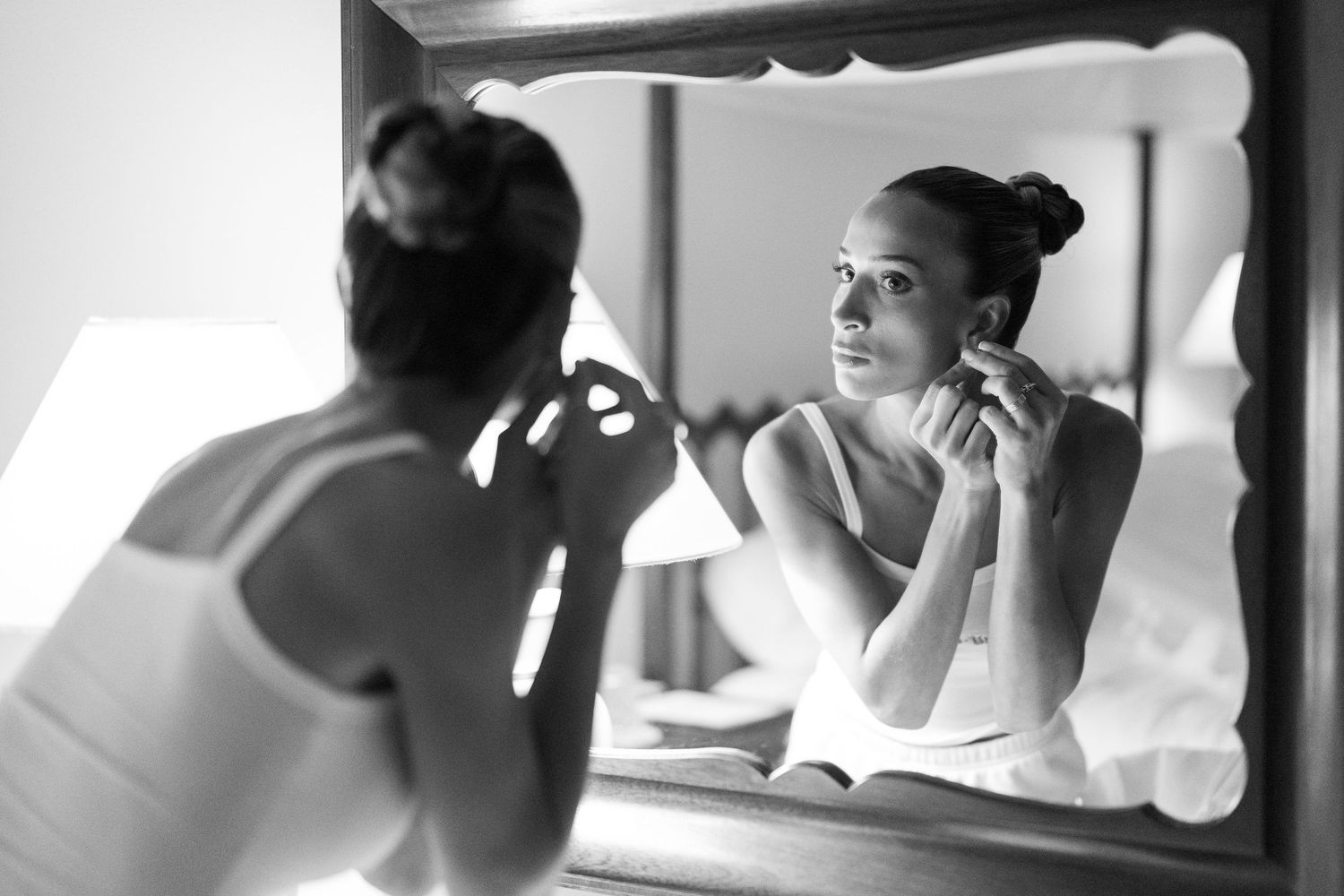Black and white series of wedding preparation moments showing reflections in mirrors and getting ready scenes.